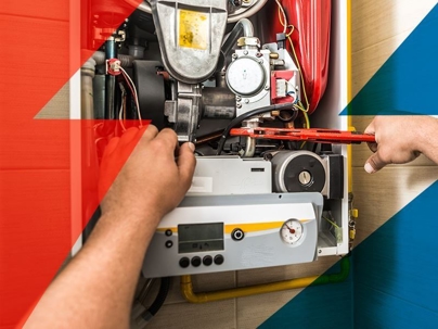 Close-up of tech working on gas furnace