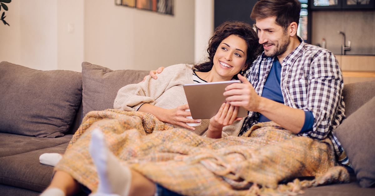 Couple sitting on their couch